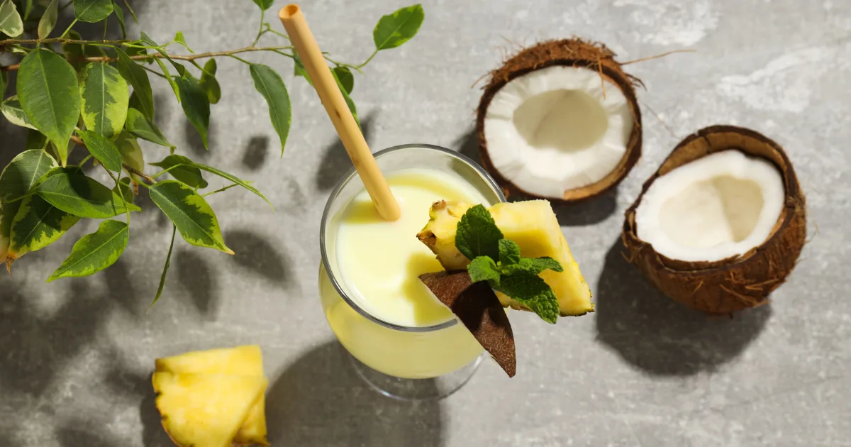 Fresh tropical fruits like pineapple, mango, and passion fruit are ideal ingredients for coconut water summer drinks.